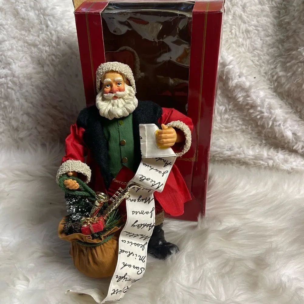 Vintage Santa with a list of names and a bag of toys porcelain and paper marché